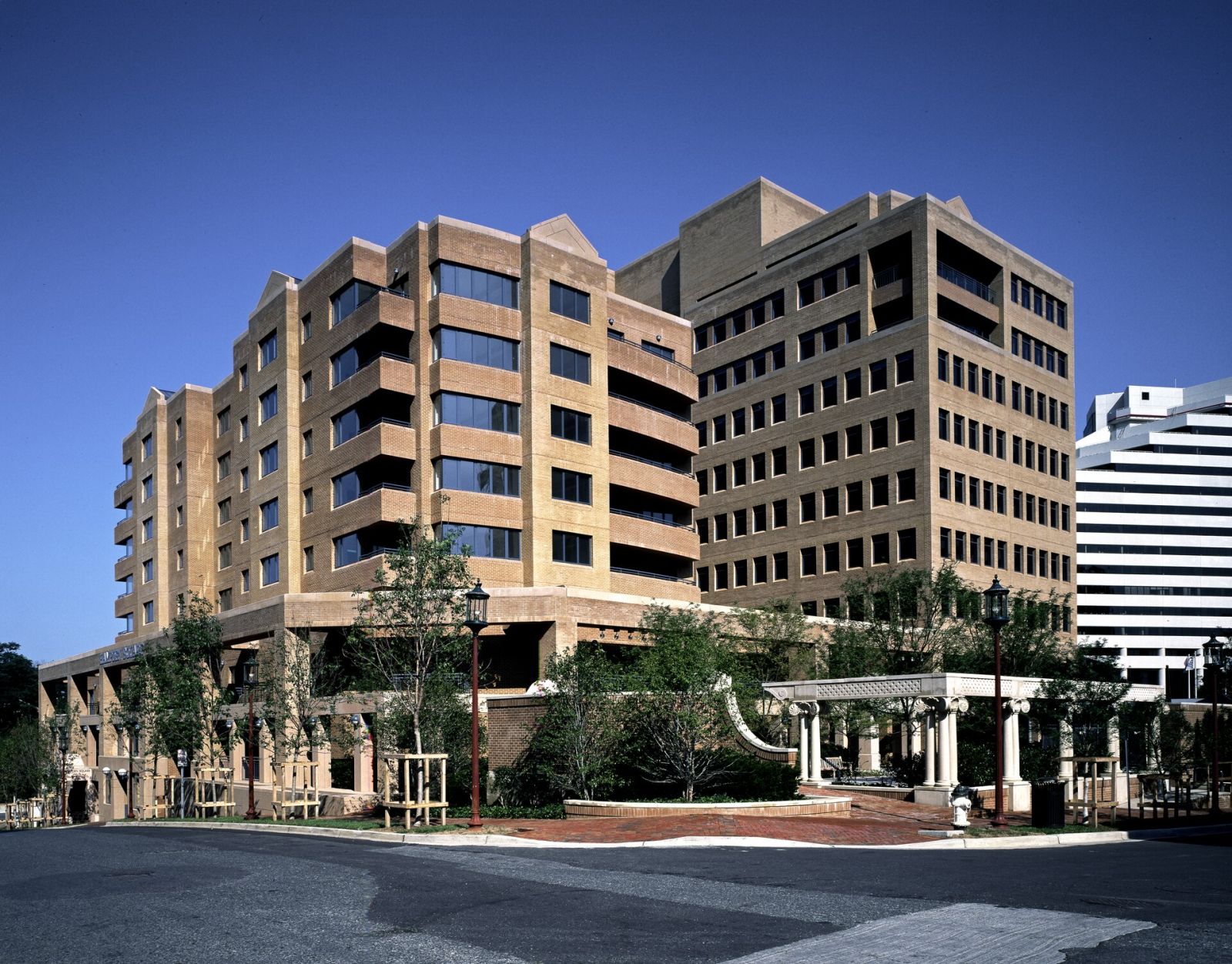 Modern corner office building with a glazed entrance
