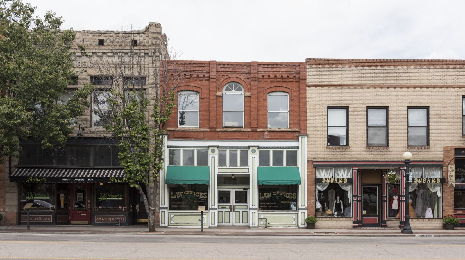 Row of historic brick storefronts on a main street